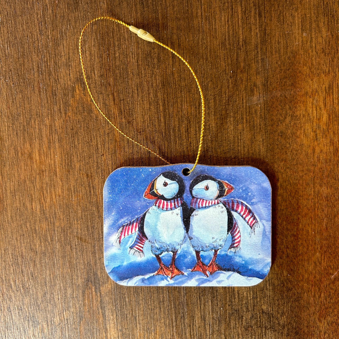 Puffins in candy cane colored scarves ornament